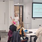 Laura, Lead Psychotherapist delivering a workplace talk
