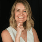 headshot of laura smiling in a white top