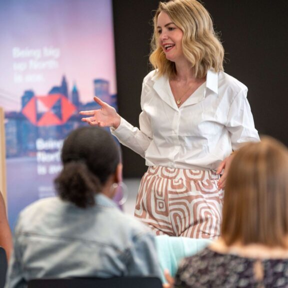 laura speaking to a group of women